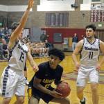 Montesanos Sam Winter, left, defends Aberdeens Derrell Shale in the post in the second quarter of a game on Friday. (Hasani Grayson | Grays Harbor News Group)
