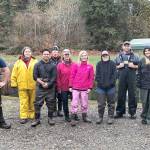 PHOTO COURTESY OF GRAYS HARBOR COLLEGE FISH LAB                                 Grays Harbor College Fish Lab volunteers joined alumni Steve Franks recently to surplus coho at the Satsop Springs Fish Rearing Facility.