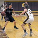 Ocostas Cole Hatton looks to dribble past South Bends Mayson Estle in the second quarter on Wednesday. (Hasani Grayson | Grays Harbor News Group)