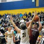 Hoquiams Matt Brown (42) shoots a post fade away while Aberdeens Nick Farrer (21) contests the shot. Brown led the Grizzlies with 20 points. (Hasani Grayson | Grays Harbor News Group)