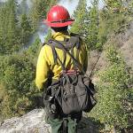 A crew member monitors a prescribed burn at Yosemite National Park. Fire helps recycle important nutrients back into the soil and makes way for new grasses, wildflowers and other plants. (National Park Service file photo)