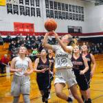Ocostas Kjirstin Hopfer cuts to the lane for a layup as time expired in the first quarter against Raymond. Hopfer led the team with a game-high 26 points in The Wildcats 65-27 win on Friday. (Hasani Grayson | Grays Harbor News Group)