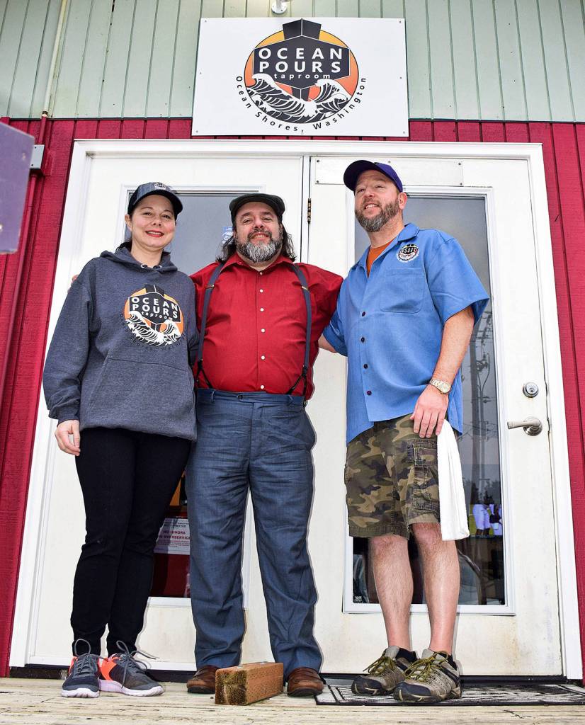 From left, bartender Beth Douglas, general manager Chris Shifman and co-owner Randy Gardner of the newly opened Ocean Pours Taproom.
