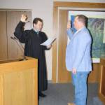 Michael Lang | Grays Harbor News Group                                Grays Harbor County Auditor Joe MacLean (right) is sworn in to office Jan. 2 by Judge David Mistachkin in County Commission chambers in Montesano.
