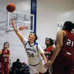 Grays Harbors Sandin Kidder puts up a scoop shot against Skagit Valley on Friday in Aberdeen. Kidder scored 25 points to lead all scorers in the contest. (Hasani Grayson | Grays Harbor News Group)