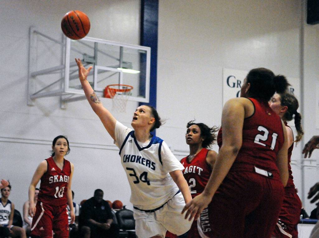 Grays Harbors Sandin Kidder puts up a scoop shot against Skagit Valley on Friday in Aberdeen. Kidder scored 25 points to lead all scorers in the contest. (Hasani Grayson | Grays Harbor News Group)