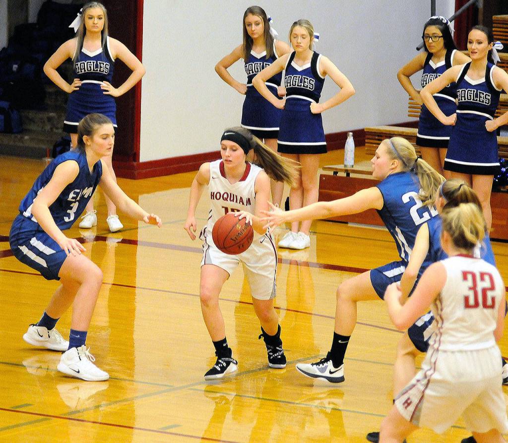 Elmas Quin Mikel, right, and Jayln Sackrider, right, come together to double team Hoquiams Tauni Hilliard in the fourth quarter on Saturday. Mikel collected four steals in the game. (Hasani Grayson | Grays Harbor News Group)