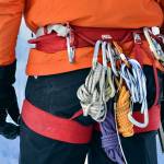 Larry Shiu, a teacher with Yamnuska Mountain Adventures, keeps extra ropes and carabiners on his harness.