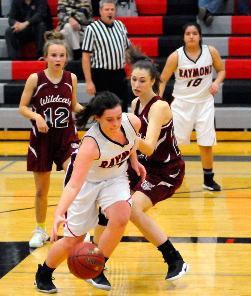 Raymonds Hannah Miller drives by Ocostas Kylee Poirier in the fourth quarter on Tuesday in Raymond. Miller led the Seagulls with 13 points. (Hasani Grayson | Grays Harbor News Group)