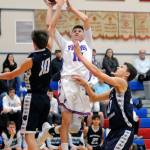 Willapa Valleys Chad Flemitis attempts a shot against two Northwest Christian defenders during the first half of Thursdays game in Menlo. (Ryan Sparks | Grays Harbor News Group)