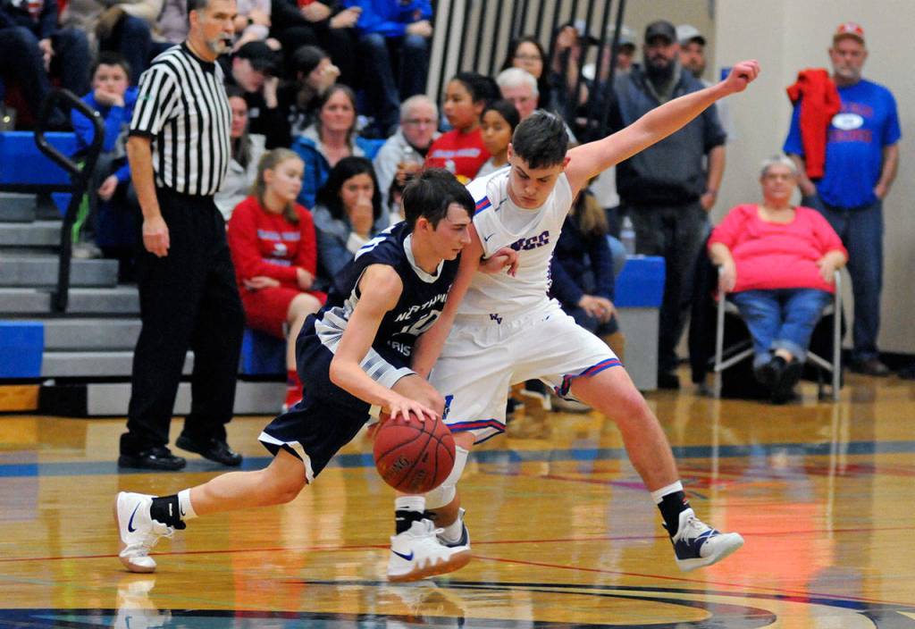 Willapa Valleys Matt Pearson, right, defends against Northwest Christians Tyler Fox on Thursday at Willapa Valley High School. (Ryan Sparks | Grays Harbor News Group)