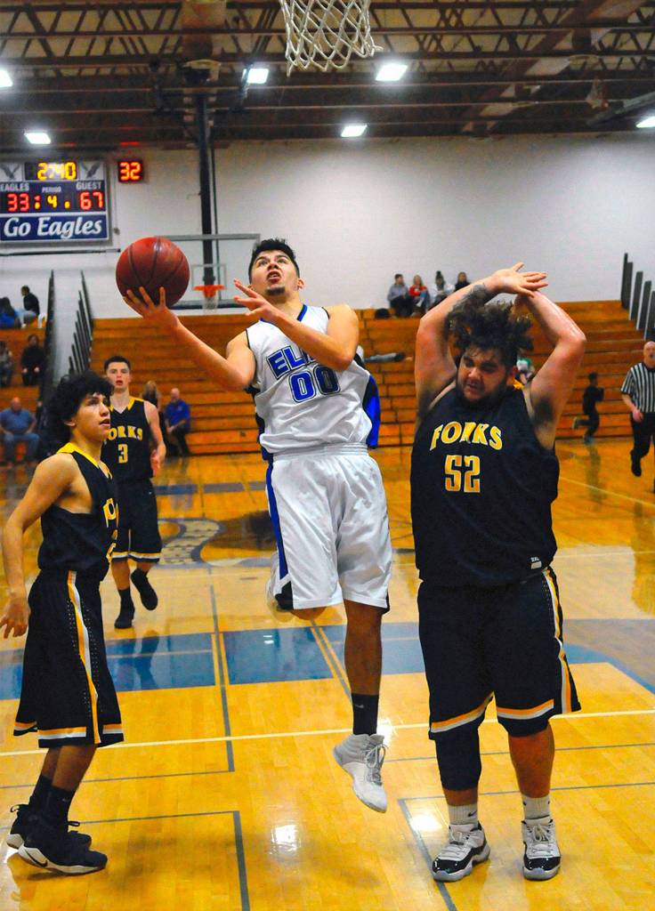 Elmas Jesus Torres hits a layup against Forks on Thursday. (Hasani Grayson | Grays Harbor News Group)