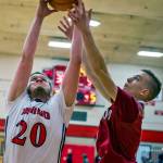 Hoquiams Garrett Dick, right, battles Teninos Alex Bratton for a rebound on Friday night. (Jared Wenzelburger | Centralia Chronicle)