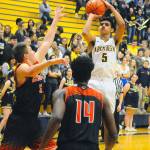 Aberdeens Javier Bojorge (5) pulls up for a mid-range jumper in the first quarter against Centralia on Friday. Bojorge led the Bobcats with 20 points in their 57-54 win over the Tigers. (Hasani Grayson | Grays Harbor News Group)