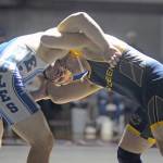 Elmas Ben Bridge, left, grapples with Aberdeens Tyler Sherman in the 220-pound final of the 40th Annual Grizzly Alumni Invitational on Saturday in Hoquiam. (Ryan Sparks | Grays Harbor News Group)