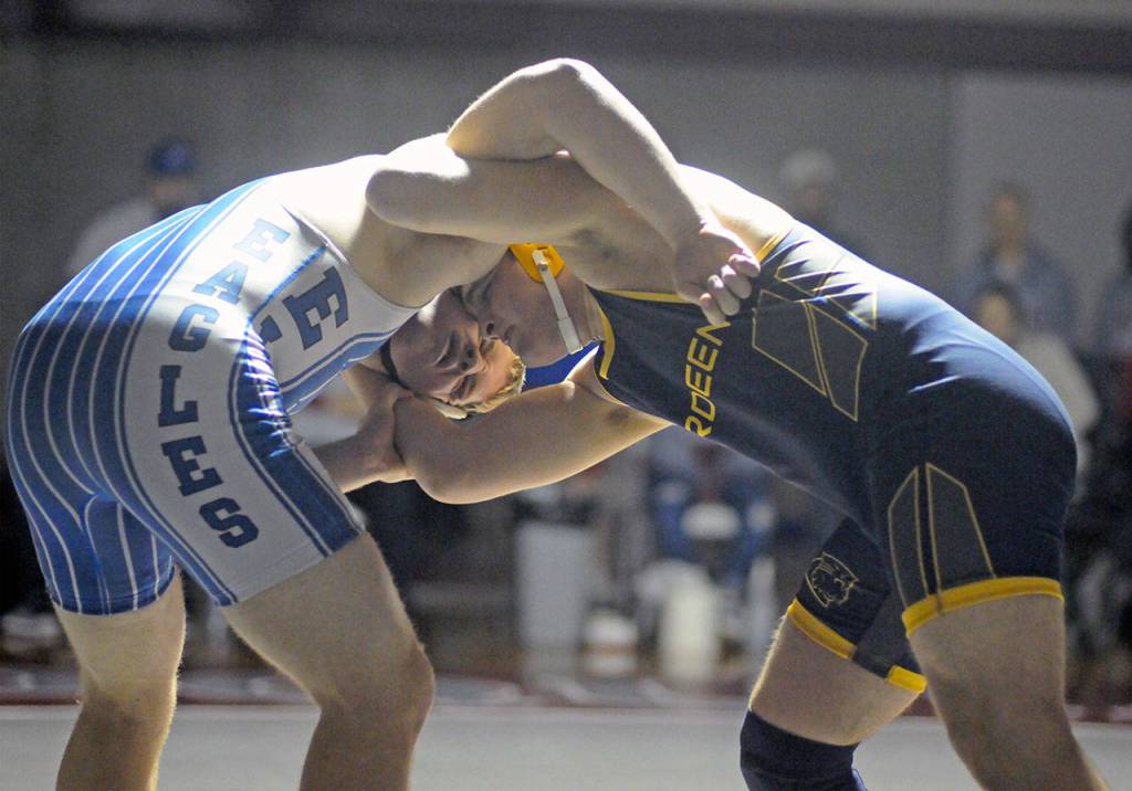 Elmas Ben Bridge, left, grapples with Aberdeens Tyler Sherman in the 220-pound final of the 40th Annual Grizzly Alumni Invitational on Saturday in Hoquiam. (Ryan Sparks | Grays Harbor News Group)