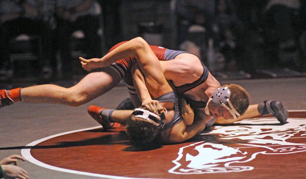 Hoquiams Brady Cummings, top, controls Willapa Harbors Luke Borden during the 170-pound final on Saturday at Hoquiam High School. (Ryan Sparks | Grays Harbor News Group)