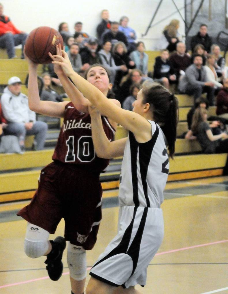 Ocostas Emily Snider tries to get by Northwest Christians Becca Sowers on Saturday. Ocosta defeated Northwest Christian 48-29. (Hasani Grayson | Grays Harbor News Group)