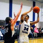 Grays Harbors Carl Fischer looks to put up a shot from the low post while defended by Highlines Tristan Miguel in the first half. (Hasani Grayson | Grays Harbor News Group)