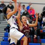 Willapa Valleys Brooke Friese rises for a shot against Ocostas Kjristin Hopfer during the Wildcats 43-40 win on Tuesday. (Ryan Sparks | Grays Harbor News Group)