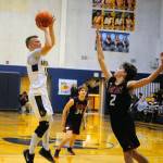 Aberdeens Ben Dublanko, left, hits a fade away jumper over Black Hills Avery Armin on Wednesday at Sam Benn Gym. (Hasani Grayson | Grays Harbor News Group)