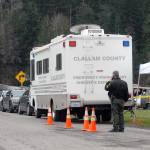 Chief Criminal Deputy Brian King talks on his phone outside an emergency command center set up on Lower Elwha Road west of Port Angeles on Thursday after a suspect was arrested in connection with a triple homicide last December. (Keith Thorpe/Peninsula Daily News)