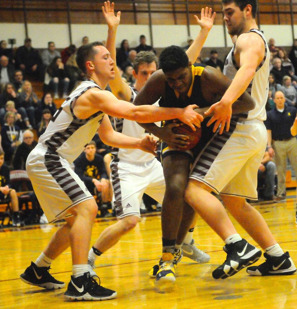 Montesanos Shaydon Farmer, left, and Tanner Nicklas, right, double try to steal the ball from Forks Trey Baysinger. (Hasani Grayson | Grays Harbor News Group)