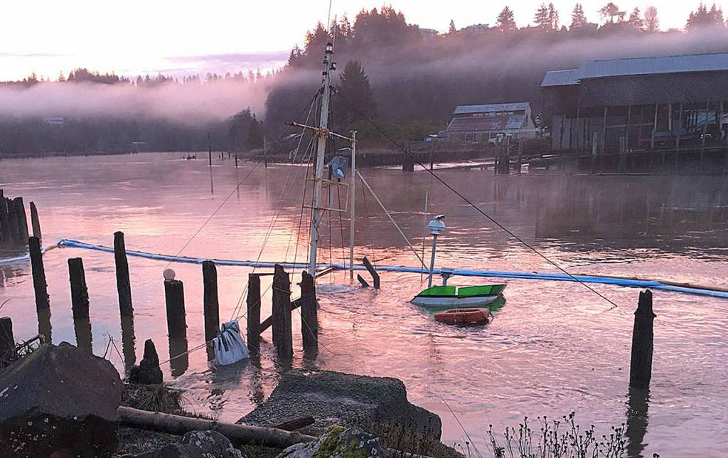 COURTESY DEPARTMENT OF ECOLOGY SPILLS PROGRAM                                The Lady Grace, a 70-foot fishing vessel, sank in the Hoquiam River just north of the Riverside Bridge in March of last year. Ecology Spills Program responders removed 890 gallons of fuel from the vessel, and an estimated 196 gallons of diesel fuel and lube oil were discharged into the river. The mast of the Lady Grace is still visible above the water line.