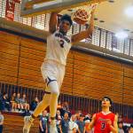 Hoquiams Rayyon Dayton, left, dunks in the fourth quarter against Tenino on Tuesday. Dayton led the Grizzlies with 13 points in Hoquiams 55-20 win over Tenino. (Hasani Grayson | Grays Harbor News Group)