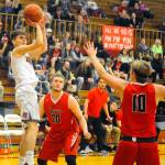 Hoquiams Garrett Dick, left, pulls up for a baseline jumper against Tenino in the first quarter. (Hasani Grayson | Grays Harbor News Group)