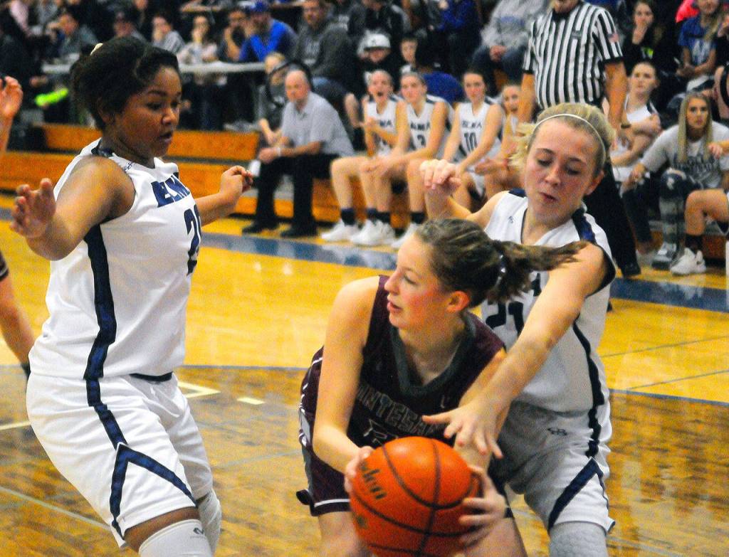 Elmas Alle Bol, right, and Kayli Johnson double team Montesanos Matti Eckerson in the third quarter on Friday (Hasani Grayson | Grays Harbor News Group)