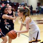 South Bends Karley Reidinger, right, drives to the hoop in a win over Raymond on Wednesday. South Bend earned a No. 4 seed and a first-round bye in this weeks 2B District IV Tournament. (Photo by Larry Bale)