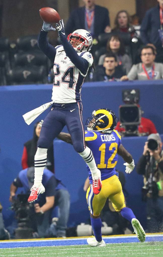 New England Patriots cornerback Stephon Gilmore (24) intercepts a pass intended for Los Angeles Rams wide receiver Brandin Cooks (12) in the fourth quarter during Super Bowl LIII at Mercedes-Benz Stadium in Atlanta on Sunday, Feb. 3, 2019. The Patriots won, 13-3. (Curtis Compton/Atlanta Journal-Constitution/TNS)