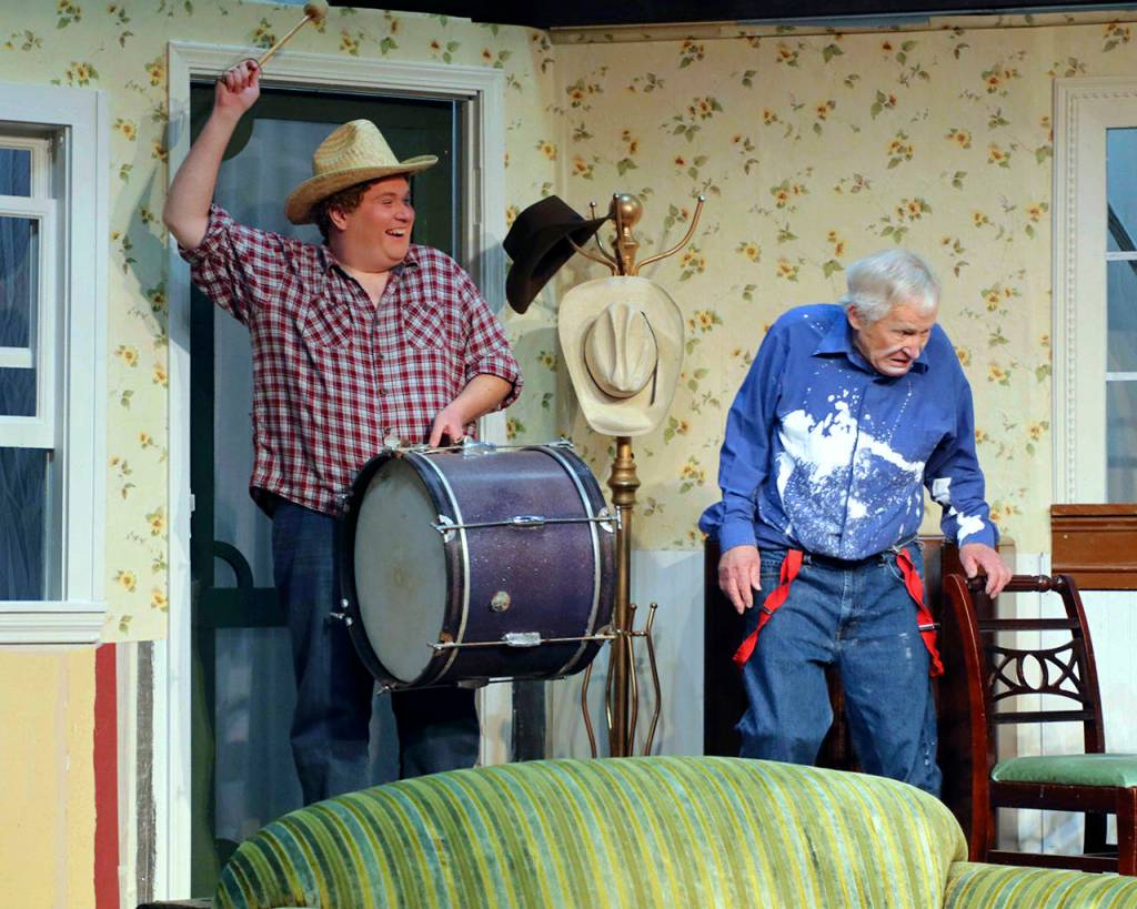 Jim (Matthew Kline) is more enthusiastic than his father H.C. (Dave Foscue) in trying to implement Starbucks instructions on how to drum up some long-needed rain. (Photo by Keith Krueger)