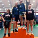 Aberdeens Tatum Heikkila (1) and Katie Gaskin (2) stand arm-in-arm atop the podium after finishing first and second, respectively, in the 190-pound class of the WIAA District IV North Sub-Regional Tournament at the Northwest Sports Hub in Centralia on Saturday. (Submitted photo)