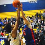 Aberdeens Derrell Shale battles for a rebound with Ridgefields Carson Knight in the third quarter on Tuesday night. (Hasani Grayson | Grays Harbor News Group)
