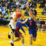 Aberdeens Ben Dublanko drives to the lane in the first quarter against Ridgefield. Dublanko led the Bobcats with 16 points in a 61-40 loss to the Spudders on Tuesday. (Hasani Grayson | Grays Harbor News Group)