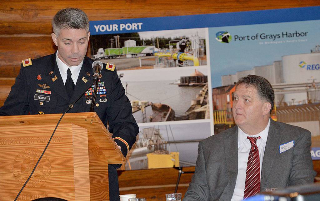 DAN HAMMOCK | GRAYS HARBOR NEWS GROUP                                Col. Mark A. Geraldi, commander of the Seattle District U.S. Army Corps of Engineers, celebrates the completion of phase 2 of the Grays Harbor shipping channel dredging project during the Port of Grays Harbor annual business report Wednesday morning. At right is Port executive director Gary Nelson.