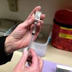 Louis Krauss | Grays Harbor News Group                                A health worker prepares a syringe to be used in vaccinations.