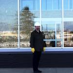 Angelo Bruscas photo: Stephen Buck stands in front of what will be the new entrance to the future home of Buck Electric/Ace Hardware, which will relocate this spring to the facility on Pt. Brown.