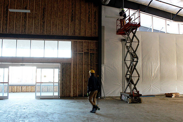 Workers complete some of the finishing touches on the interior of the new building, which will have about 33,000 square feet of space.