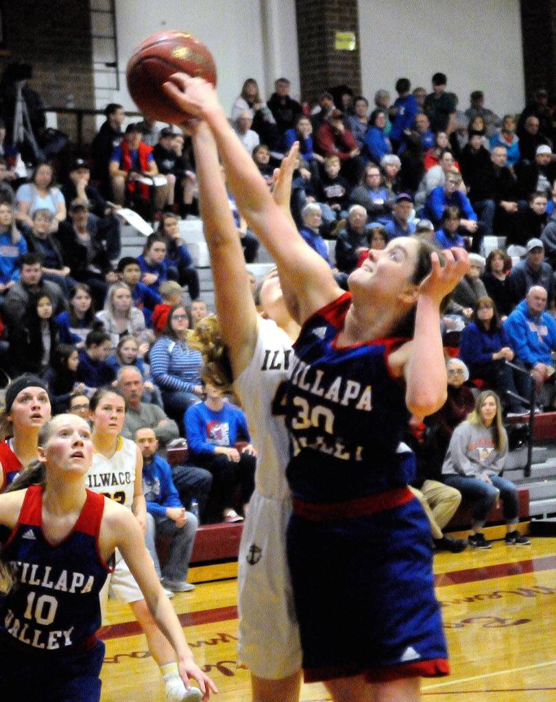 Willapa Valleys Cami Swartz blocks the shot for Ilwacos Kylie Gray in the third quarter on Friday. (Hasani Grayson | Grays Harbor News Group)