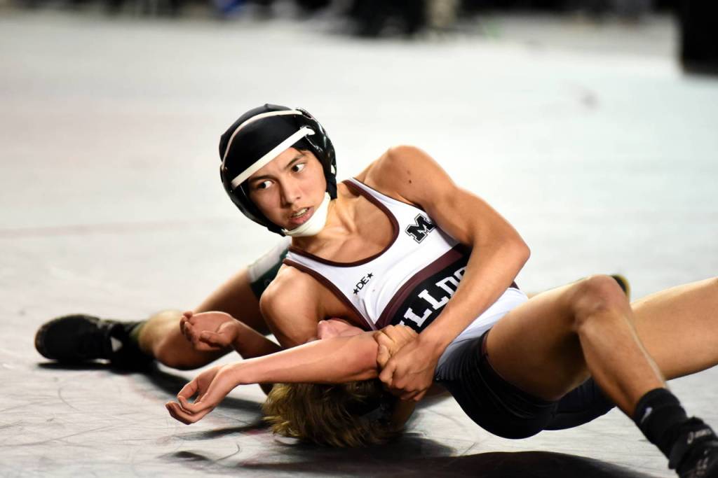 Montesanos Andy Fry, top, works to control Klahowyas Cameron Johnson at the Mat Classic wrestling tournament on Saturday. Fry won by major decision, 8-0. (Photo by Sue Michalak)