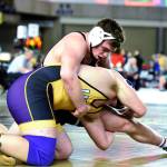 Ocostas Tucker Deranleau, top, controls an opponent during the WIAA Mat Classic XXXI state championship tournament on Saturday in Tacoma. (Photo by Sue Michalak)