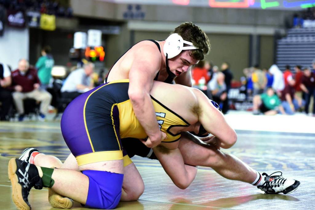 Ocostas Tucker Deranleau, top, controls an opponent during the WIAA Mat Classic XXXI state championship tournament on Saturday in Tacoma. (Photo by Sue Michalak)
