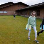 Louis Krauss | Grays Harbor News Group                                Students Jayci Johnson, left, and Aracely Padilla leave Miller Junior High last week. This grassy plot next to the school is where a modular building will go to accommodate sixth-grade-students joining the middle school next fall.