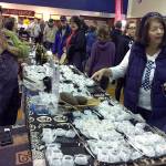 (Kat Bryant | Grays Harbor News Group) Olympia-based chocolatier Brother Bliss oversees his Blissful Wunders booth as visitors check out his handmade truffles on Saturday at the Chocolate on the Beach festival in Pacific Beach.