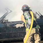 COURTESY HOQUIAM POLICE DEPARTMENT Hoquiam firefighters extinguished a fully involved car fire in an alley behind an apartment complex in the 2500 block of Sumner Avenue Friday morning.