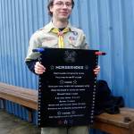 (Photo courtesy Malchert family) Daniel Malchert holds a scoring tablet thats now posted at the horseshoe pits he built at VFW Memorial Park in Montesano.