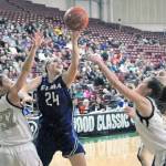 Elmas Molly Johnston splits the defense to hit a layup in the fourth quarter against Meridian in a 1A State Tournament consolation game on Friday. (Hasani Grayson | Grays Harbor News Group)